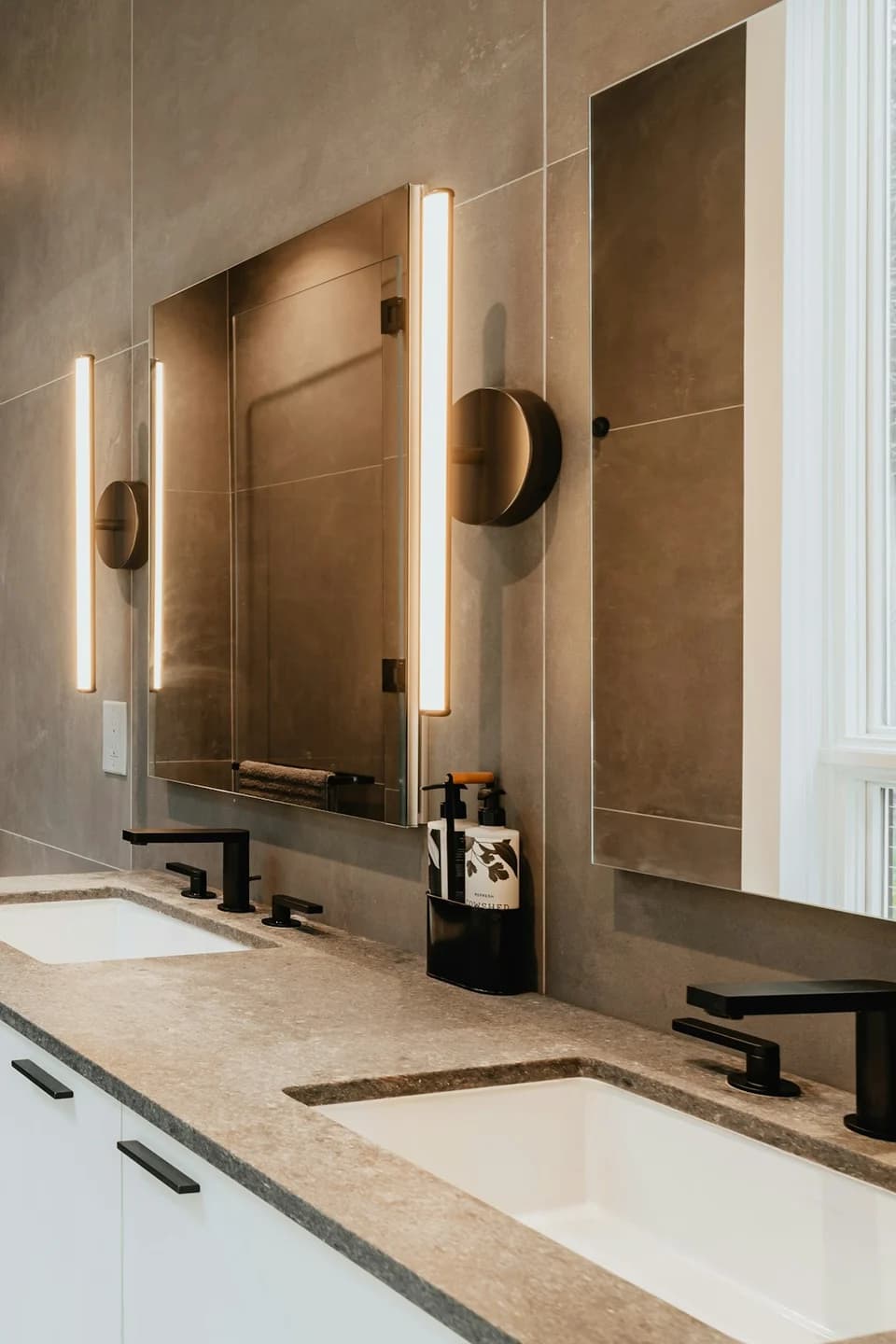 Walk-in shower with white subway tile and mosaic floor tile