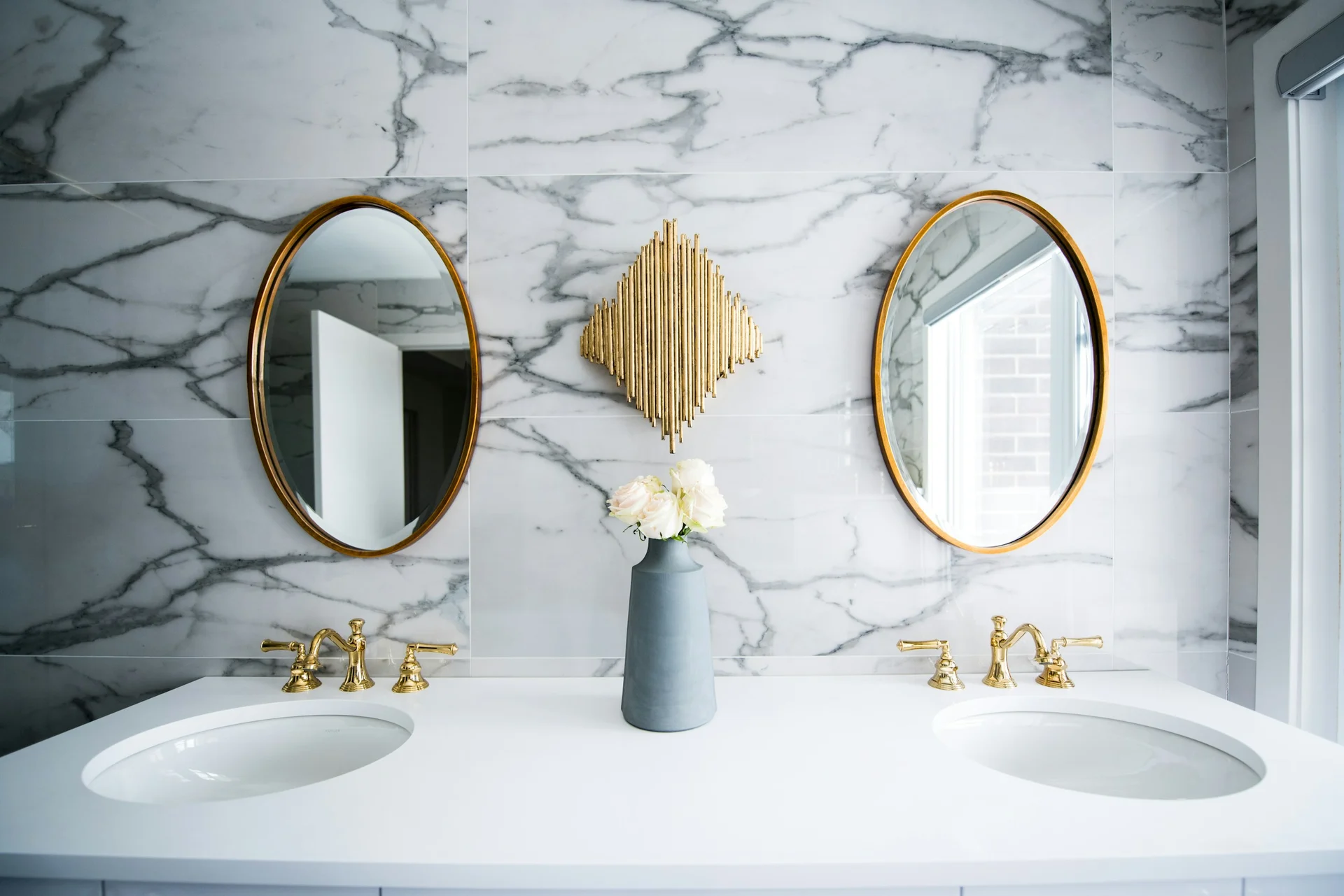 Luxury bathroom with marble-look tile, bathtub, and clean grout lines