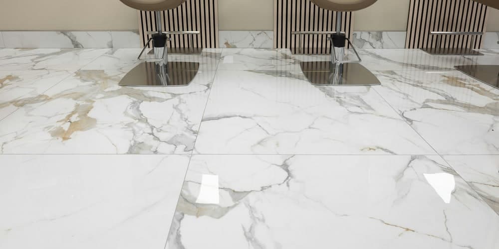 Porcelain floor tile being leveled during installation