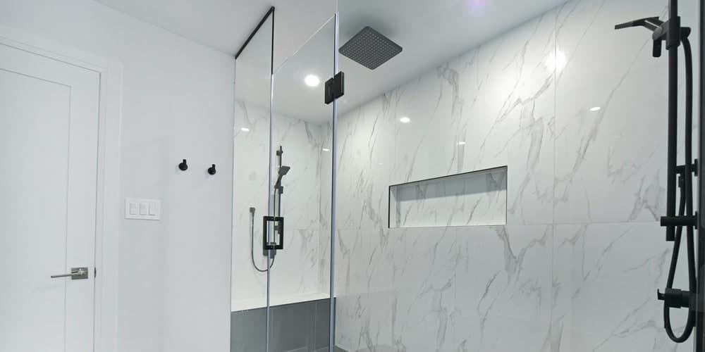 Custom shower tile installation with waterproofing and niche detail by Moonka Tiles Co.